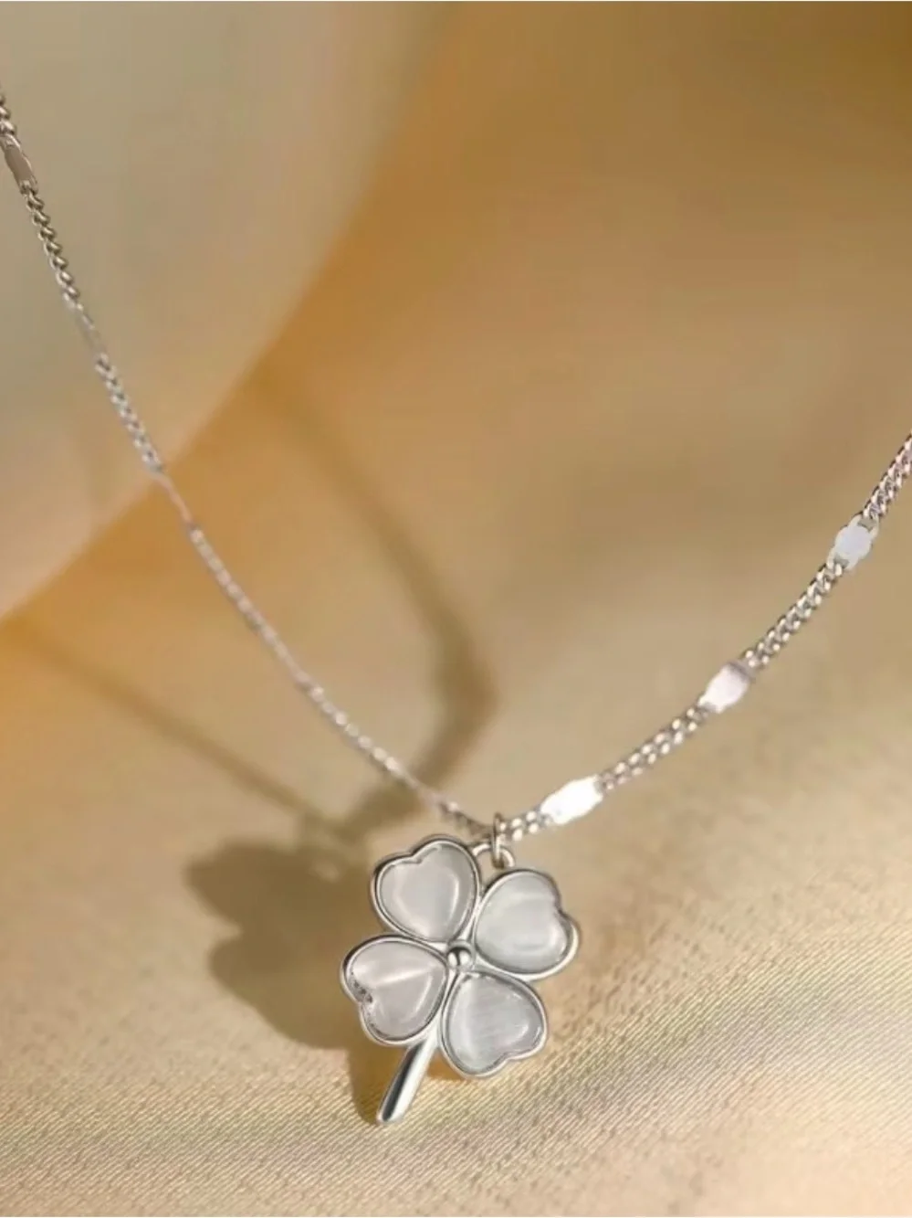 silver-tone four-leaf clover necklace white, pearlescent pendant shimmery chain